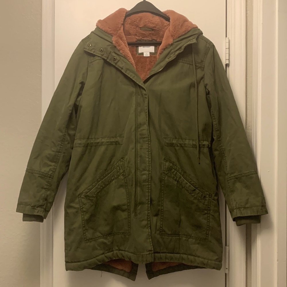 Used medium sized woman’s Jacket . Army green with mauve color faux fur lining.